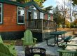 Deluxe Cabin surrounded by colorful autumn trees at Elizabethtown / Hershey KOA Holiday in Central Pennsylvania