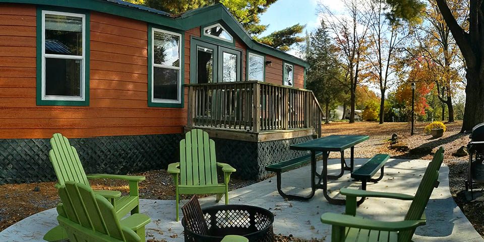 Fall Cabin Camping at Elizabethtown / Hershey KOA Holiday Deluxe Cabin surrounded by colorful autumn trees at Elizabethtown / Hershey KOA Holiday in Central Pennsylvania