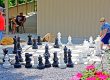 Family playing giant outdoor chess together at Elizabethtown / Hershey KOA Holiday