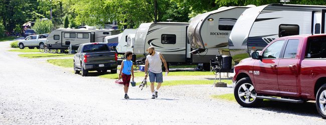 Guests walking through the RV sites at Elizabethtown Hershey KOA Holiday near Hershey Pennsylvania
