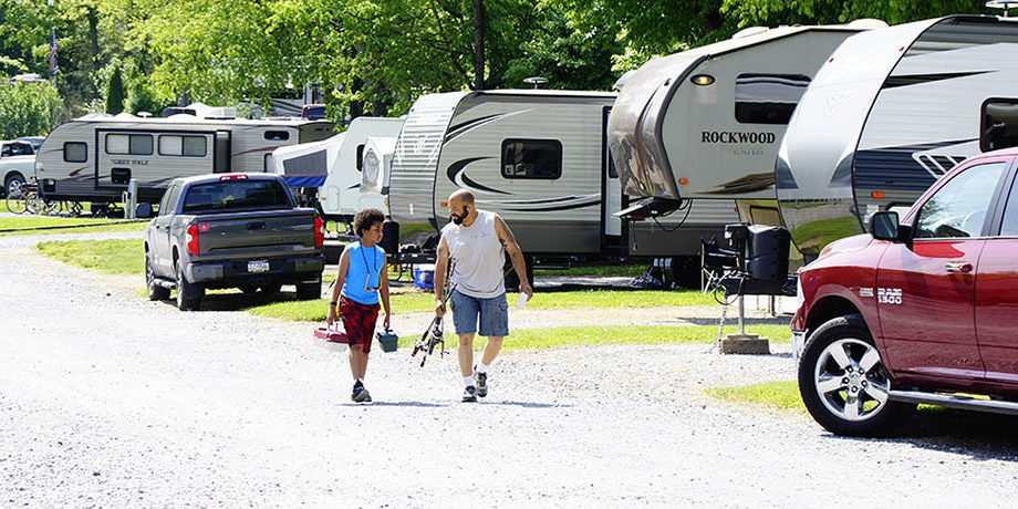 Spring Break Camping Near Hershey at Elizabethtown Hershey KOA Holiday Guests walking through the RV sites at Elizabethtown Hershey KOA Holiday near Hershey Pennsylvania